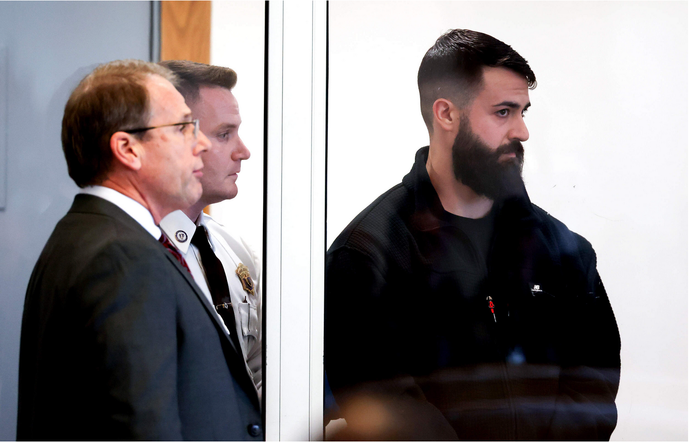 Boston Police Officer Nicholas O'Malley, right, during his arraignment in Roxbury Municipal Court in Boston on March 19 for manslaughter charges in the fatal shooting of Stephenson King. (Jonathan Wiggs/The Boston Globe, Pool via AP)