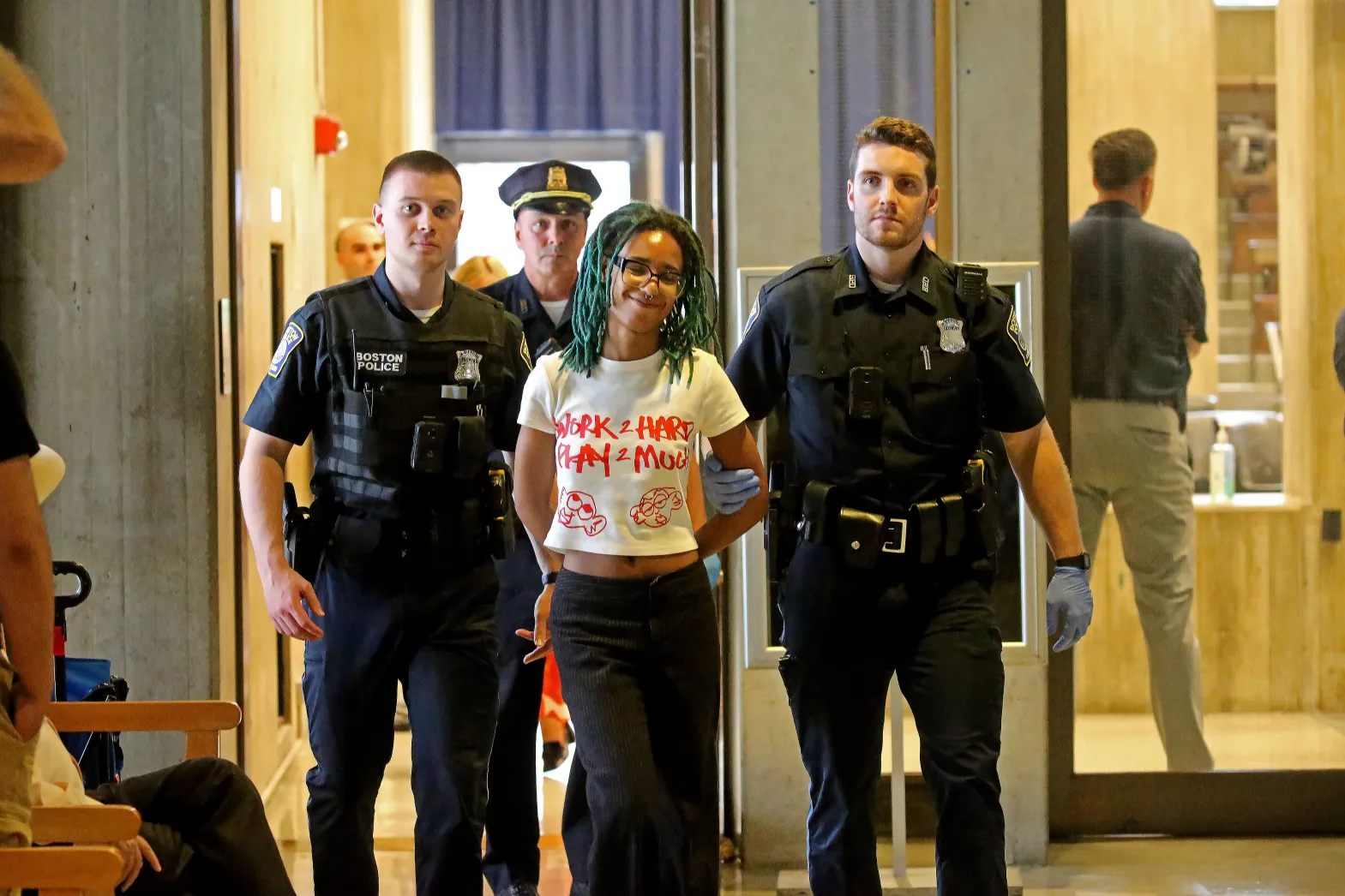 One of the protesters arrested at the City Council meeting. (Stuart Cahill/Boston Herald)