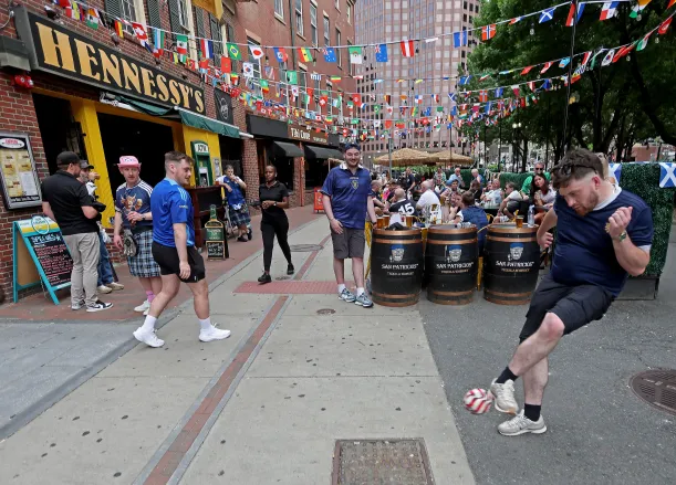 Scots arrive in Boston, as the city prepares for the World Cup. (Stuart Cahill/Boston Herald)
